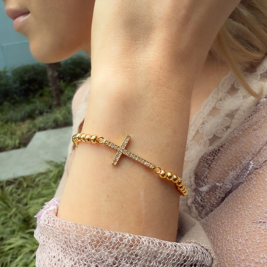 Gold Cross Beaded Bracelet with CZ Studs on model